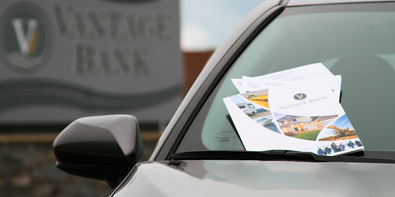 Image of car and loan paperwork