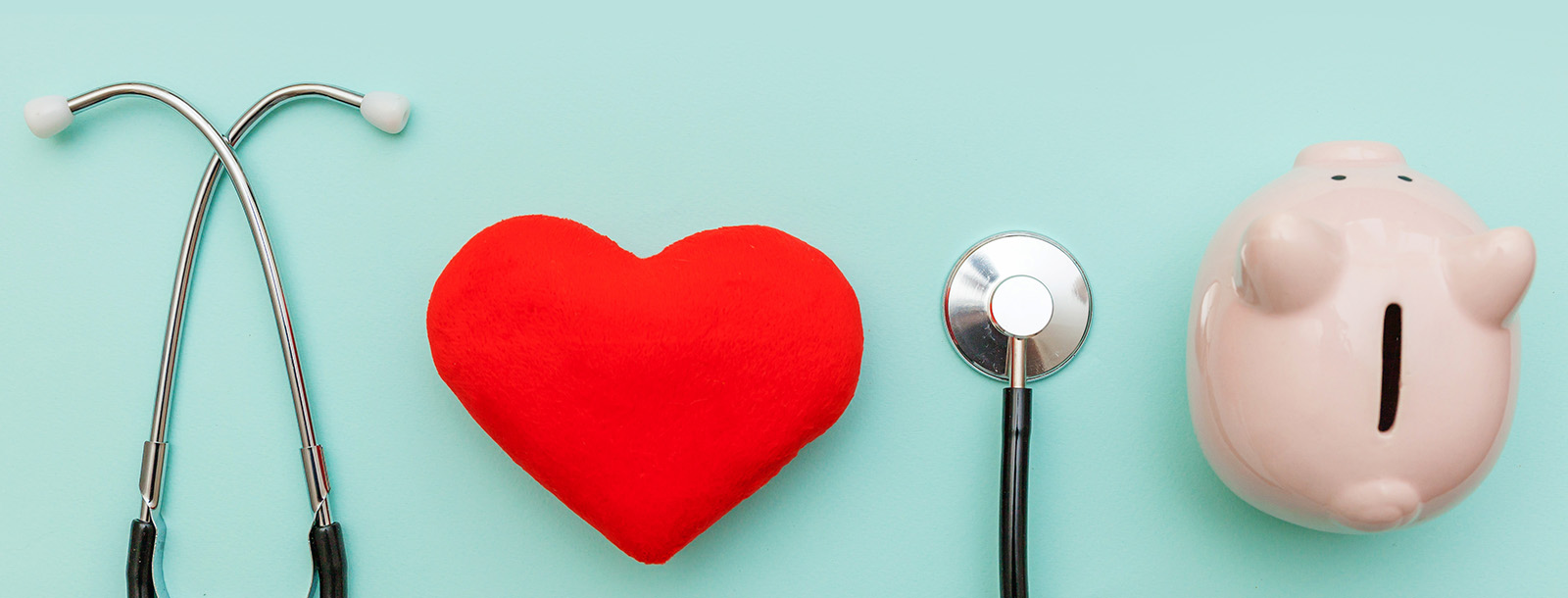 image with stethoscope, heart, and piggy bank